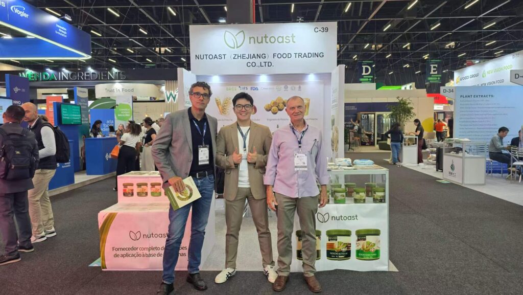 A conversation about pistachio applications at the Nutoast booth during Fi South America 2026.