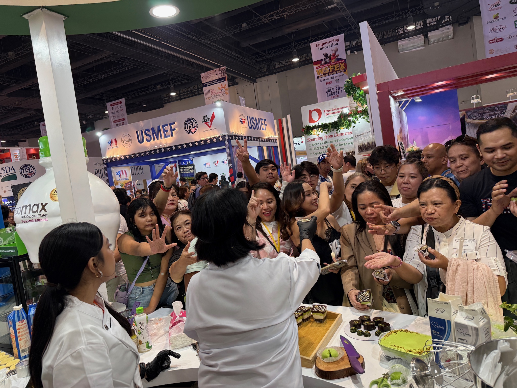 Visitors gathering around a live pistachio application demonstration at WOFEX 2026.