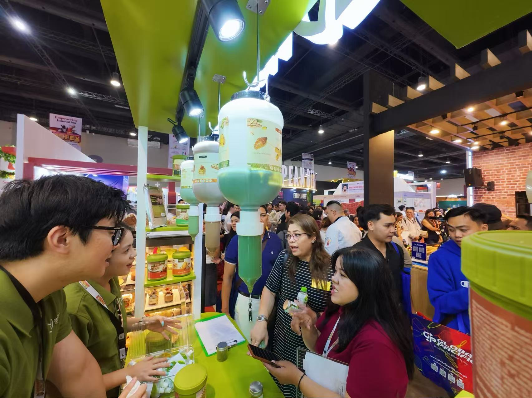 The Nutoast team discussing pistachio applications with booth visitors at WOFEX 2026.