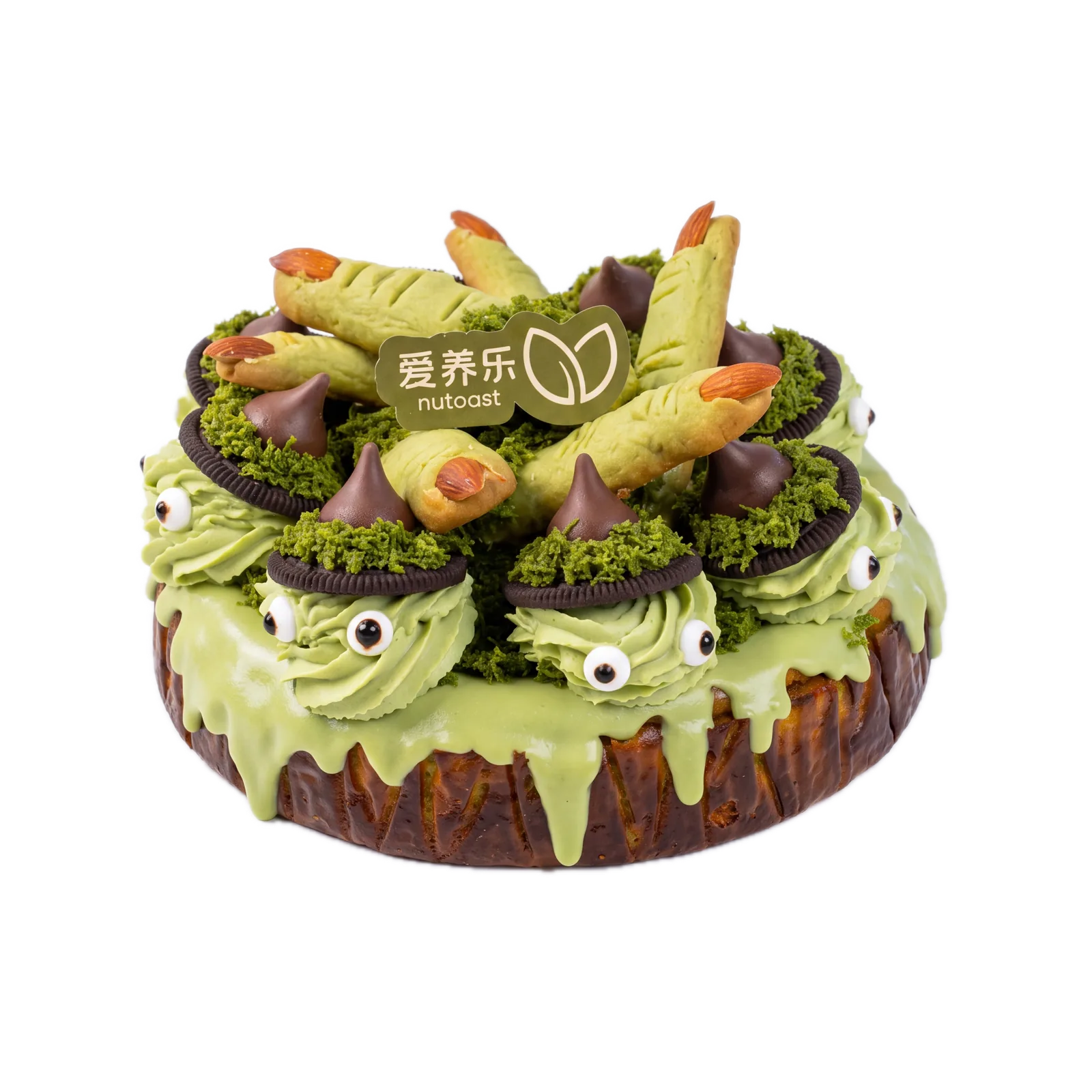 The pistachio Basque cheesecake plated together with witch finger cookies as a counter display